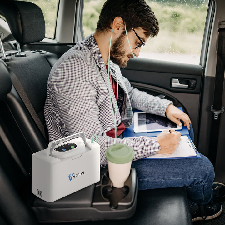 User working while using the lightweight VARON VL-2 portable oxygen concentrator, ideal for mobility and daily productivity.