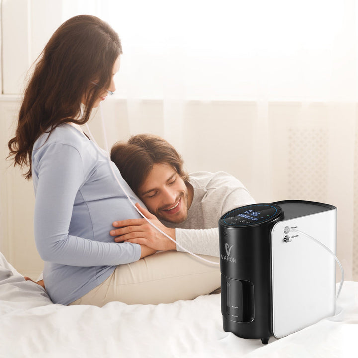 Pregnant woman receiving oxygen therapy during daily routine with VARON home oxygen concentrator
